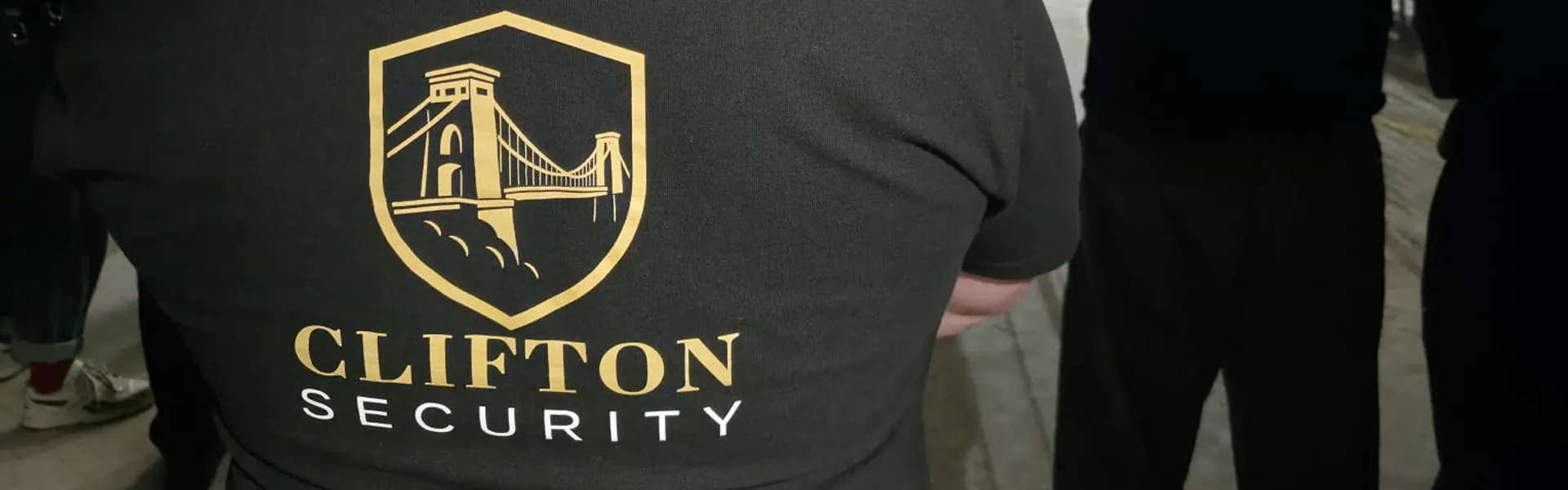 banner-clifton-security-back-of-polo